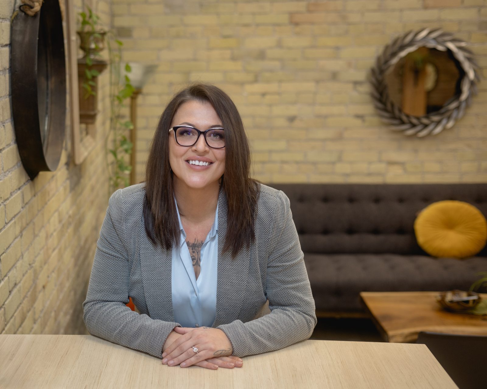 Nicole Van Hooren seated at a meeting table