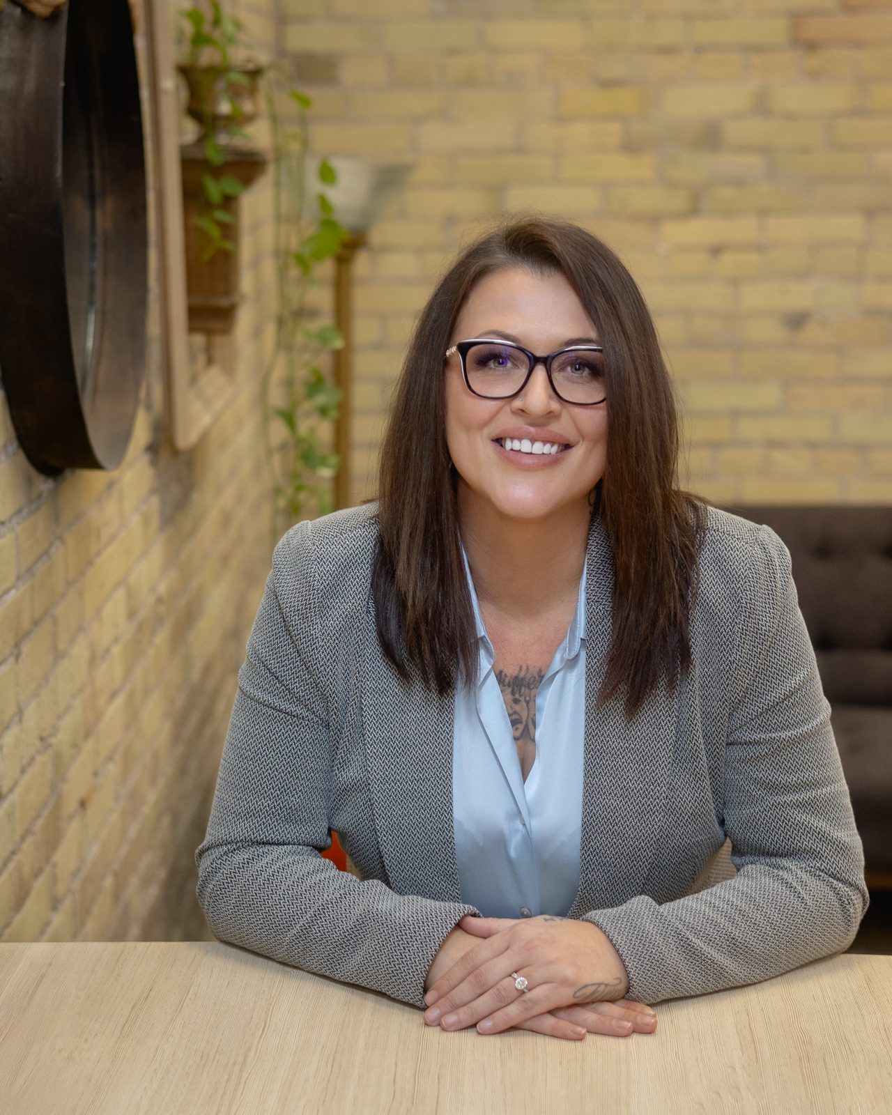 Nicole Van Hooren, paralegal, seated at a desk in her London office